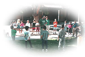 Photo - Outreach Specialist Rex Adams teaches elementary school students about tree rings.